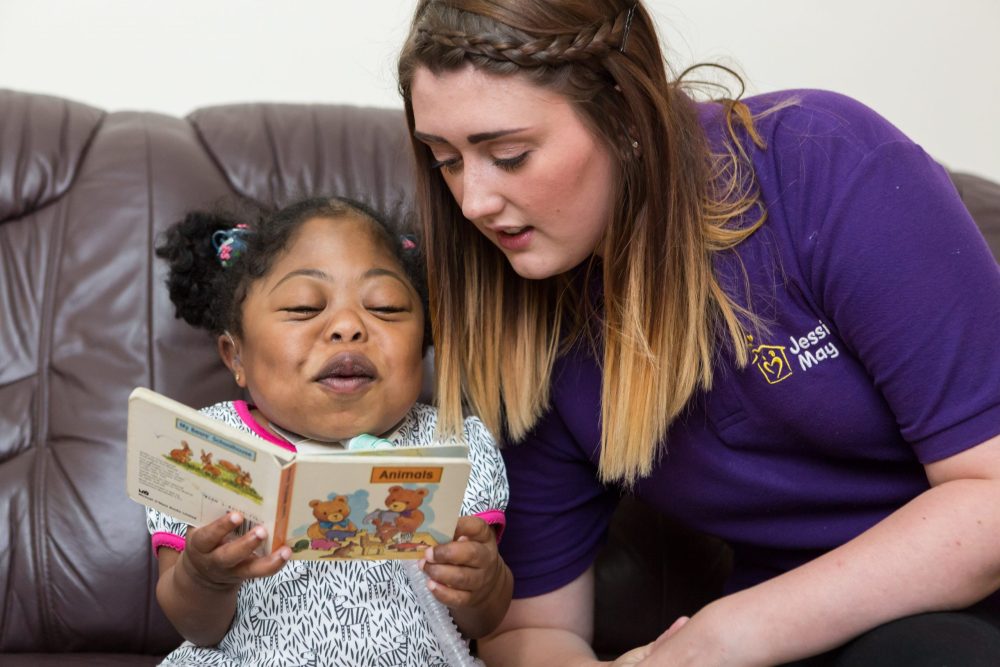 Noon reading with her Jessie May nurse, Charlotte