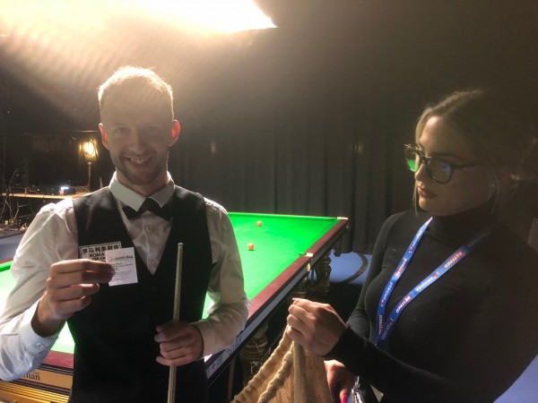 Jessie May ambassador, Judd Trump draws the raffle tickets for the World Snooker Tour World Championship Finals
