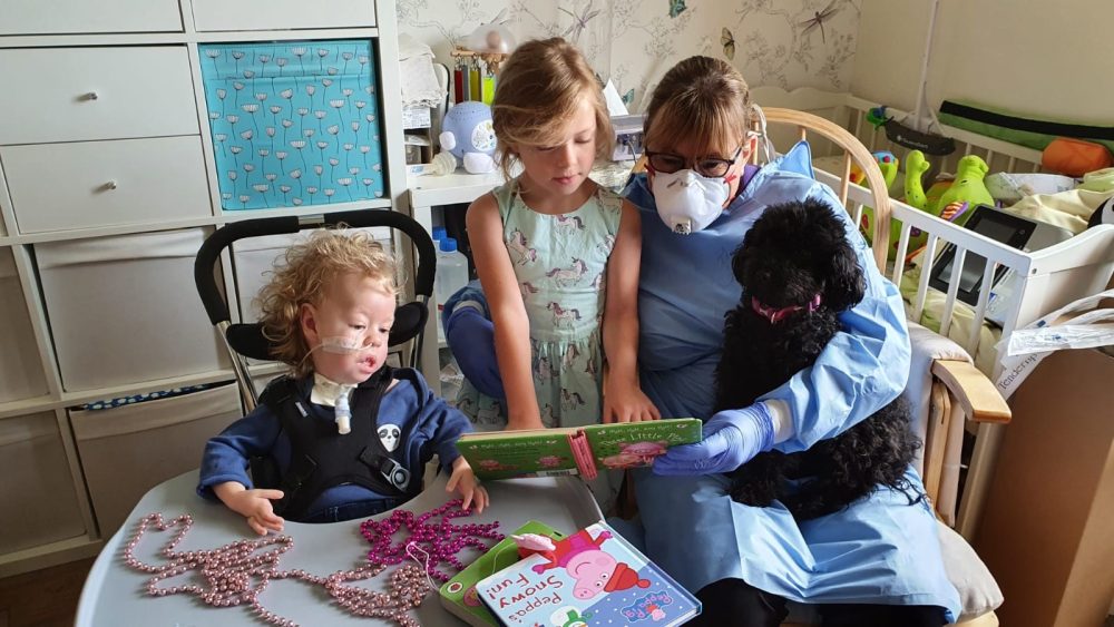 Finley, sister Charlotte and Jessie May nurse, Tina