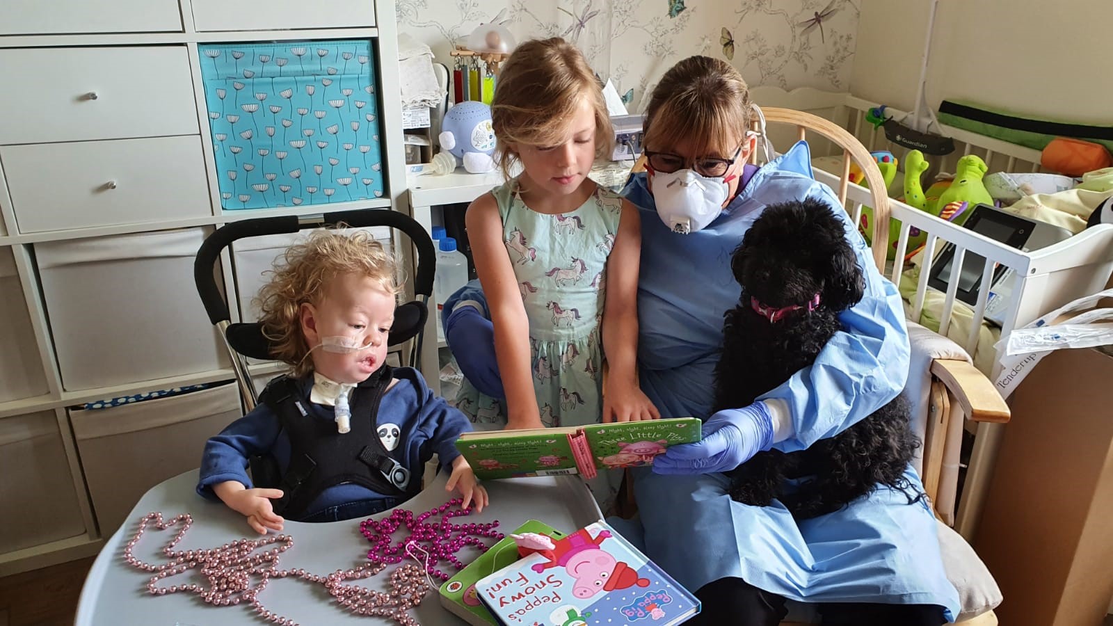 Finley, sister Charlotte and Jessie May nurse, Tina