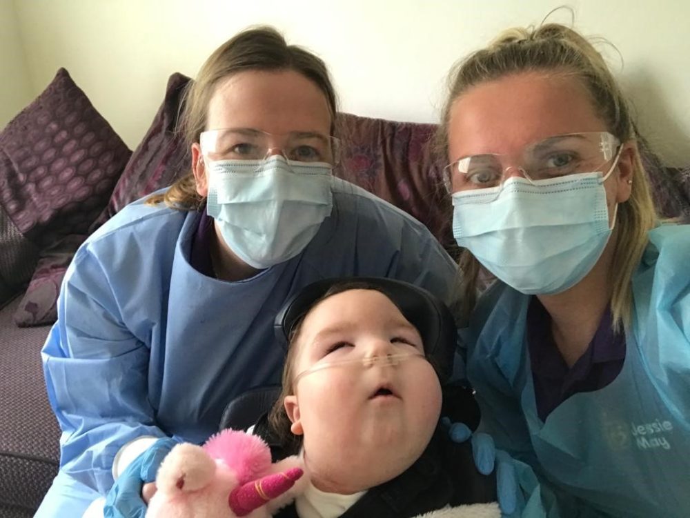 Jessie May child, Isla, and her Jessie May nurses, Lois and Bryony