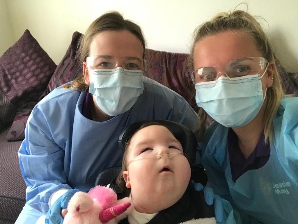 Jessie May child, Isla, and her Jessie May nurses, Lois and Bryony